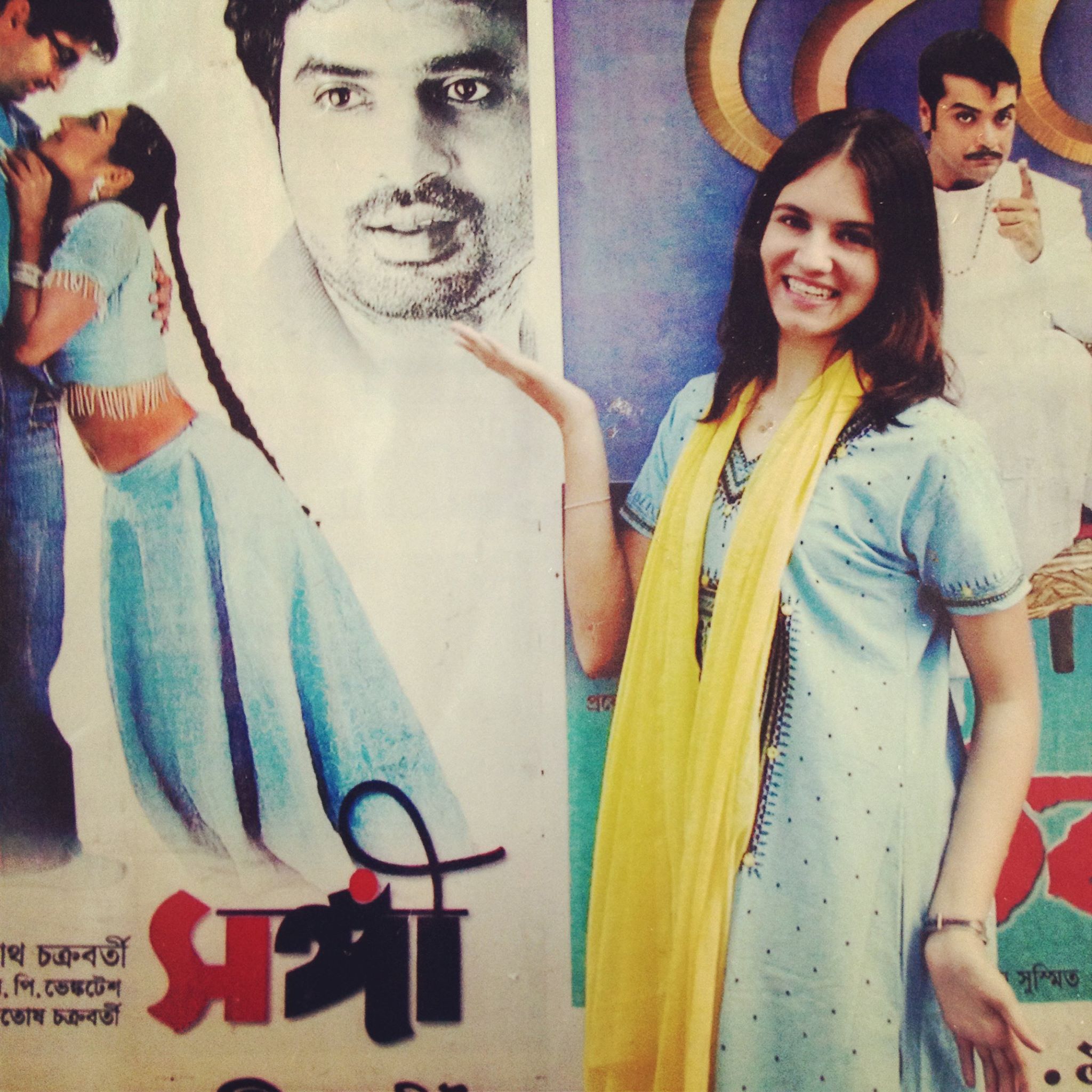 photo with Bollywood posters