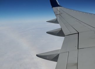 Airplane Wing in Sky