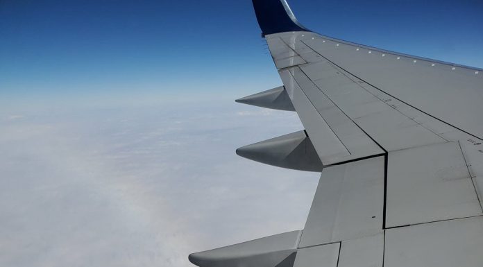 Airplane Wing in Sky