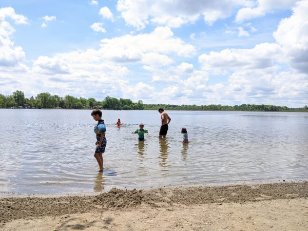 A family enjoys Park Lake in Bath Township, Michigan